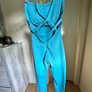 Beautiful bombshell, sportswear, turquoise bodysuit